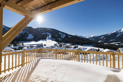 View over the mountains from the balcony of a holiday home at Alps Resorts Almdorf Hohentauern