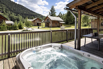 Chalet with whirlpool on the terrace at Alps Resorts Almdorf Stadl