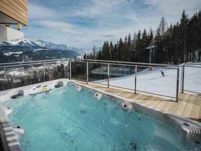 Chalet with whirlpool on the veranda at Alps Resorts Alpenchalets Reiteralm