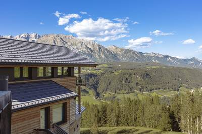 View over the mountains from the balcony of a holiday home at Alps Resorts Alpenchalets Reiteralm