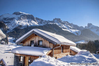 Detached wooden chalet in the snow at Alps Resorts Alpendorf Dachstein West