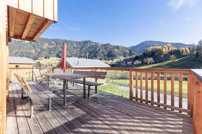 Garden furniture on the veranda of a chalet at Alps Resorts Bergeralm Chalets