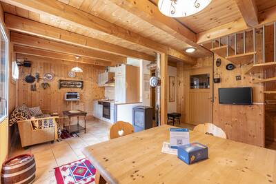 Kitchen and living room of a holiday home at Alps Resorts FerienPark Kreischberg