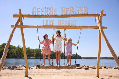 Children on play equipment in a playground at Lake Resort Beekse Bergen