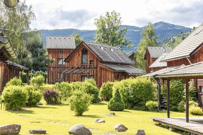 Detached holiday homes on a lawn at Alps Resorts FerienPark Kreischberg