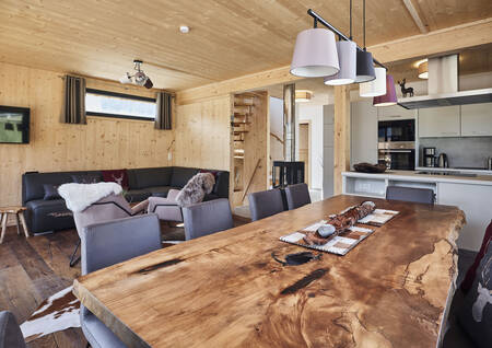 Living room with kitchen in a chalet at Alps Resorts Bergeralm Chalets