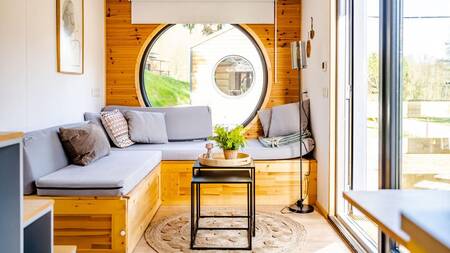 Living room of a tiny house at the Nature Parc Saint Hubert holiday park