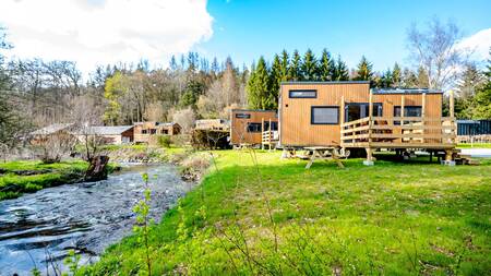 Tiny houses by the stream at Nature Parc Saint Hubert