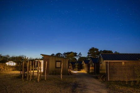 Holiday homes at night at the Roompot Ameland holiday park